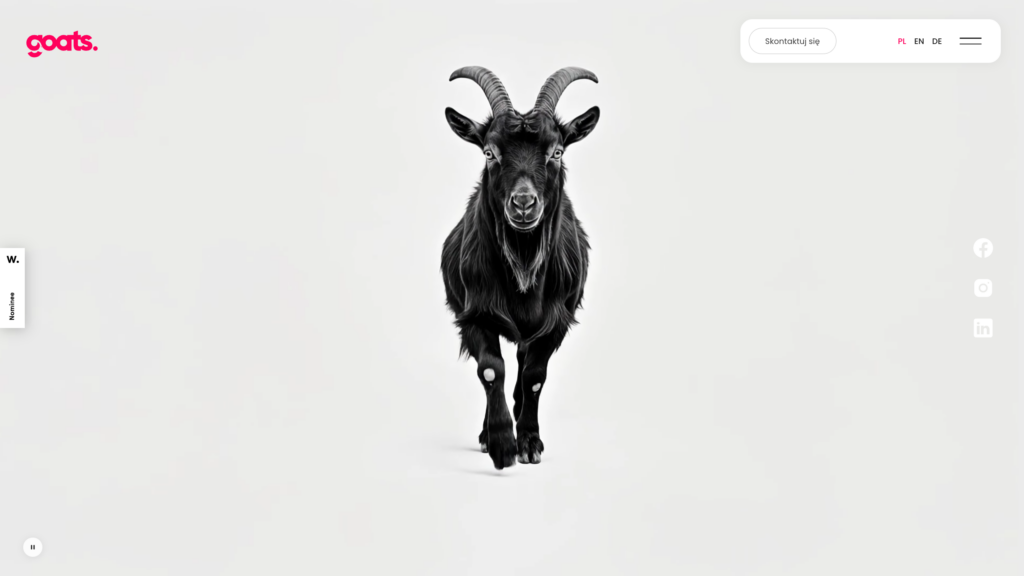 Startseite von goats.com.pl — schwarzer Ziegenbock auf hellem Hintergrund